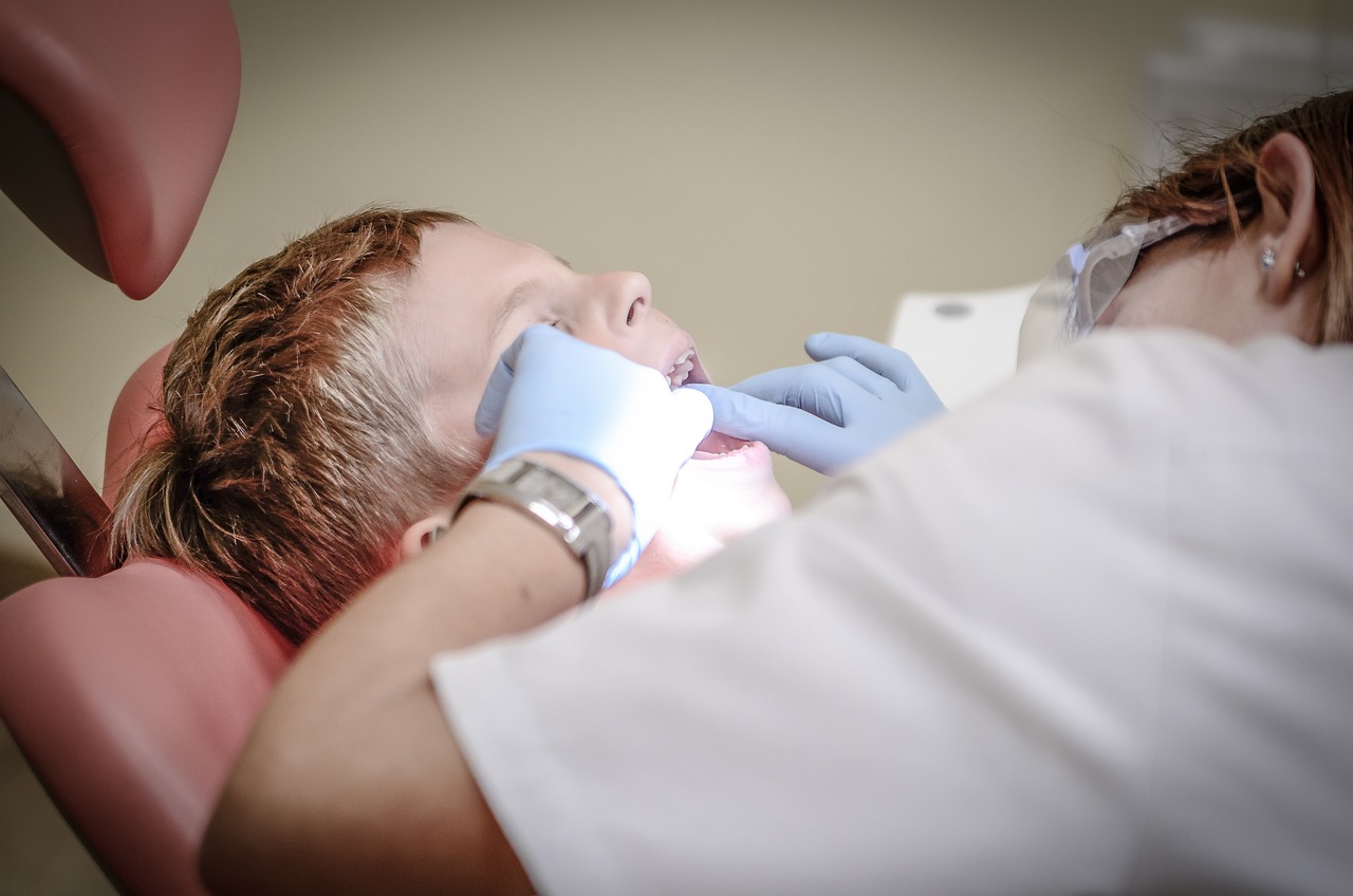 boy at dentist root canal examination